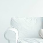 woman sitting on a white couch