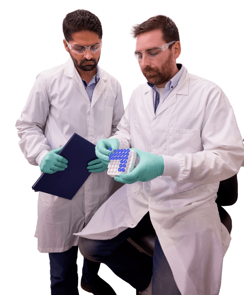 two scientists looking at lab samples
