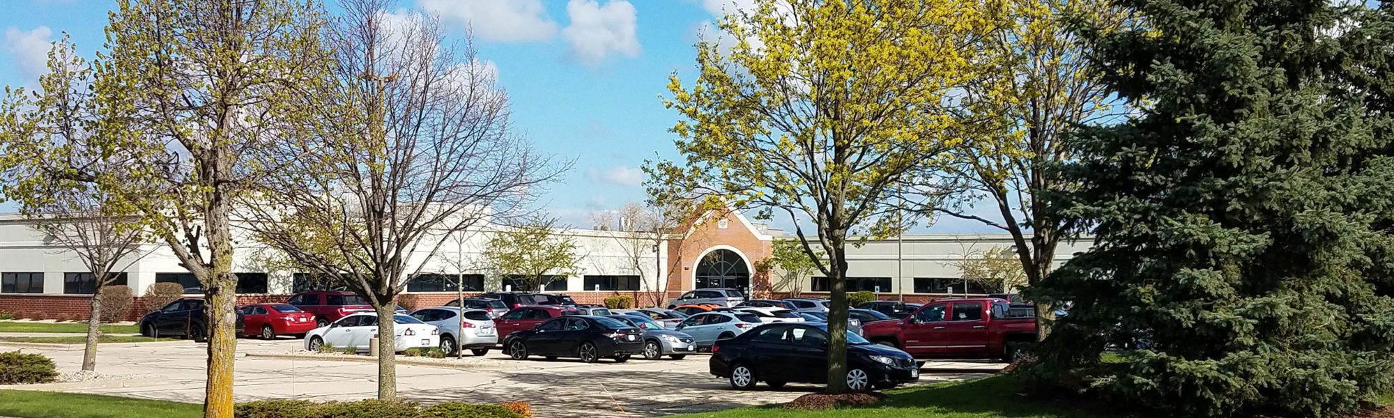 View of a parking lot and the exterior of a shopping center
