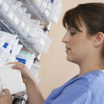 A pharmacist looking at prescription medication.