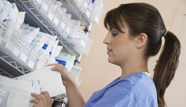 A pharmacist looking at prescription medication.