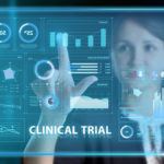 Virtual screen of the future featuring numbers, graphs and the words "clinical trial"