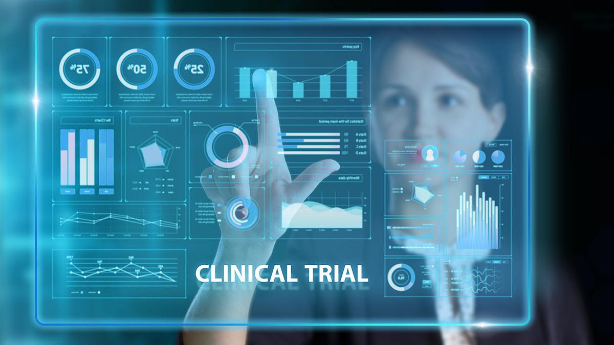 Virtual screen of the future featuring numbers, graphs and the words "clinical trial"