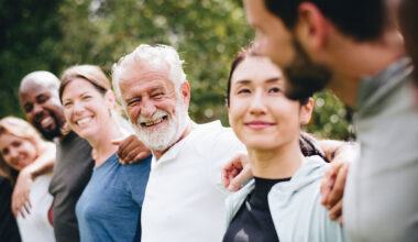 A smiling, diverse group of patients