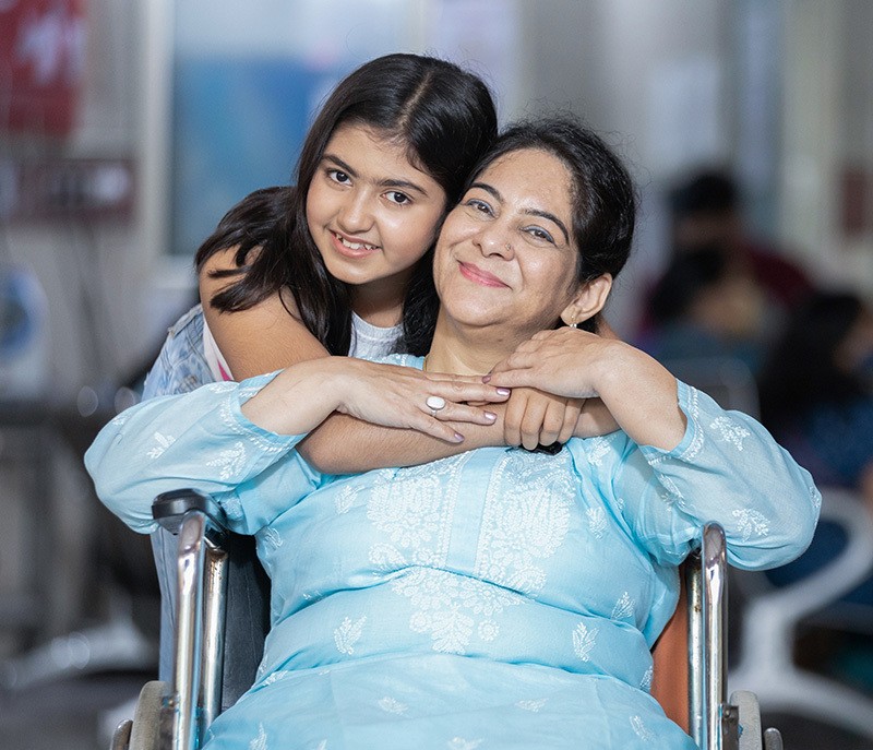 smiling-mother-wheelchair-daughter