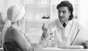 Doctor and patient discussing overcoming a complexity of an oncology and cell therapy clinical trial