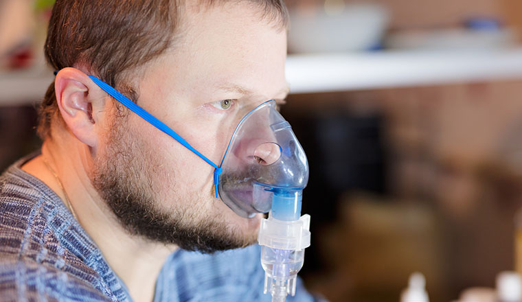 Male patient getting a respiratory breathing treatment