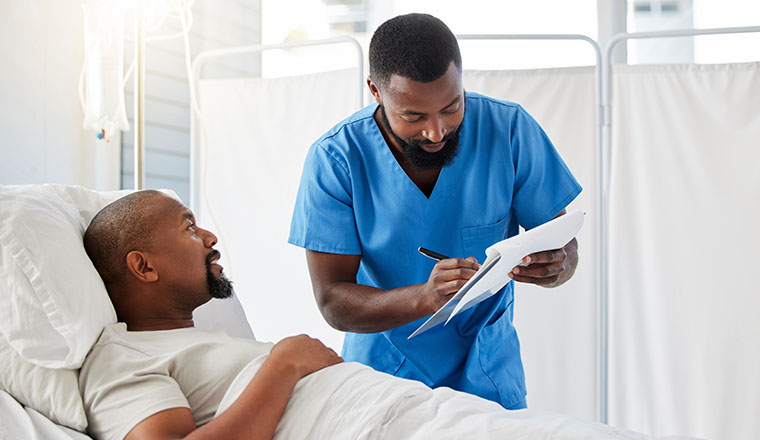 Male patient speaking to a male physician