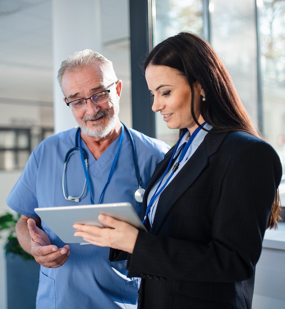 Clinical trial administrators with tablet