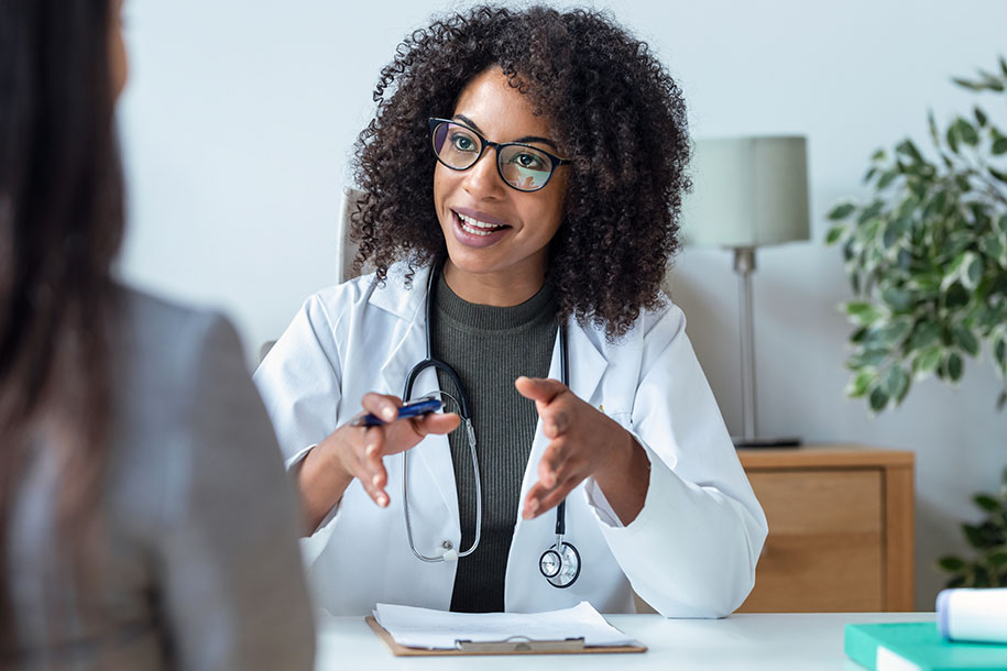 Diabetic clinical trial patient speaking to a doctor.