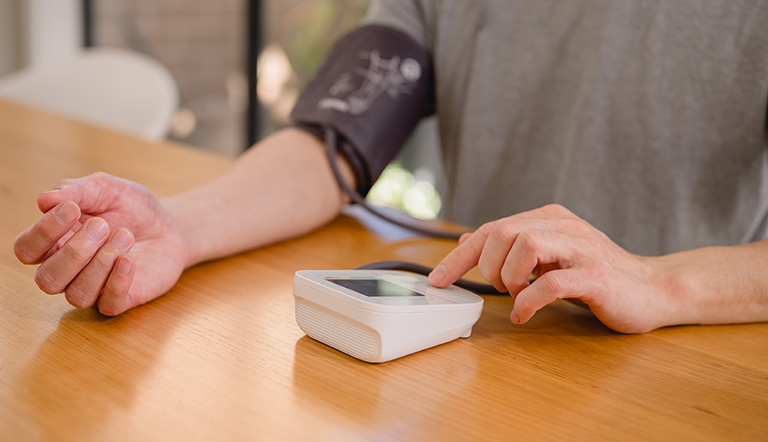 Chronic disease cardiovascular clinical trial patient using a home blood pressure device.