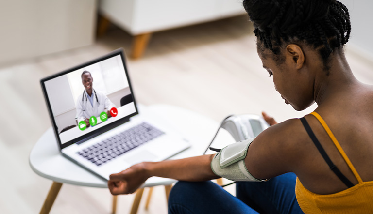 Chronic disease digital and decentralized clinical trial participant with a wearable virtually speaking to a physician.